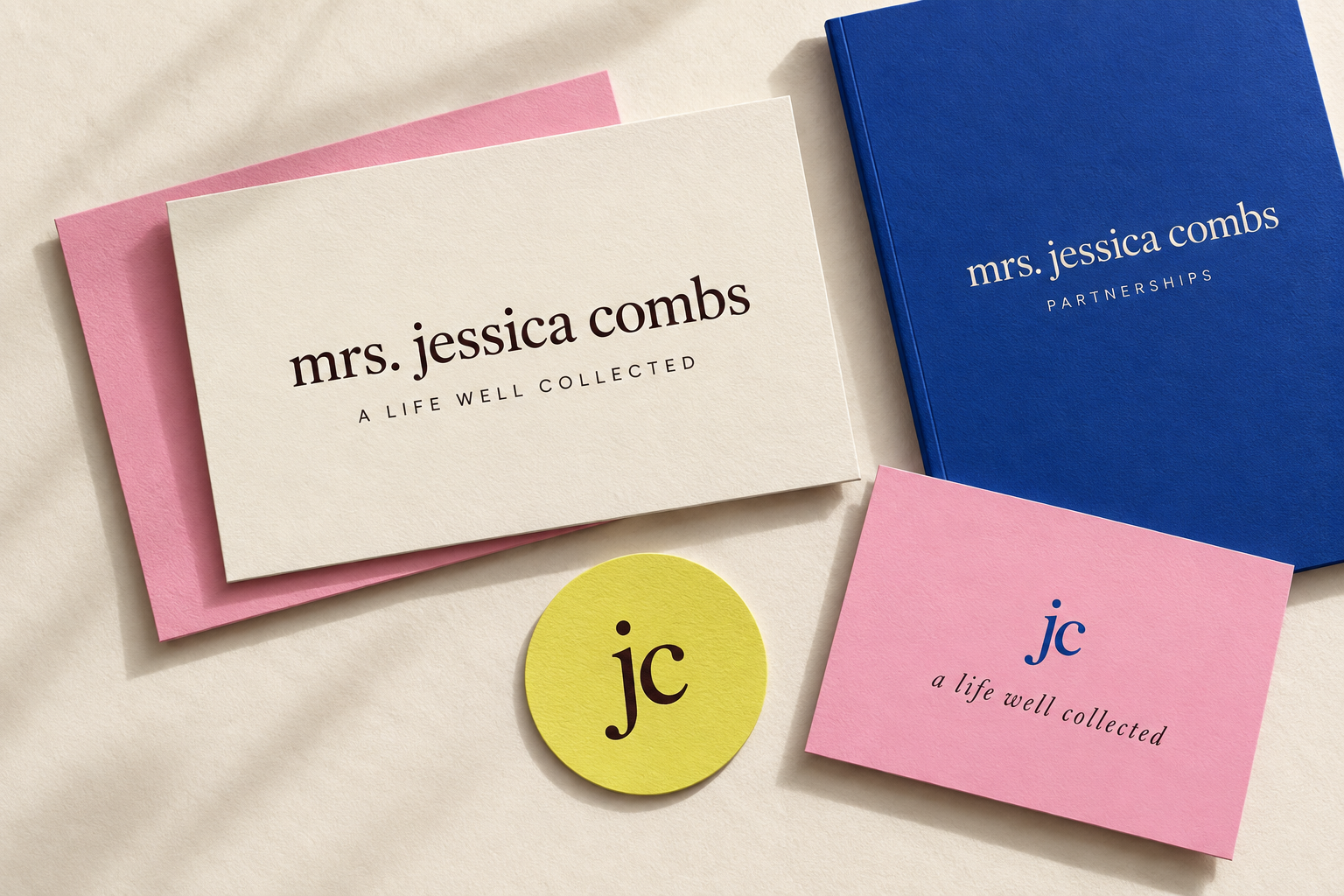 Mrs. Jessica Combs cream wordmark card, cobalt partnership booklet, citrus jc seal and pink monogram card