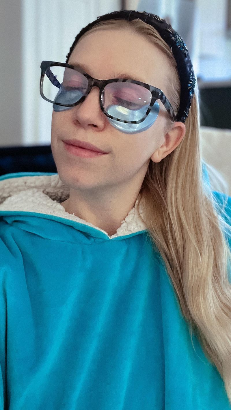 Jessica in glasses and under-eye patches during her beauty routine